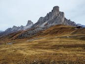 Breathtaking aerial view of the Dolomites in Veneto, Italy, showcasing the rugged mountain landscape in autumn.